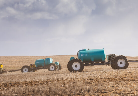 Spray tank that is portable on a trailer