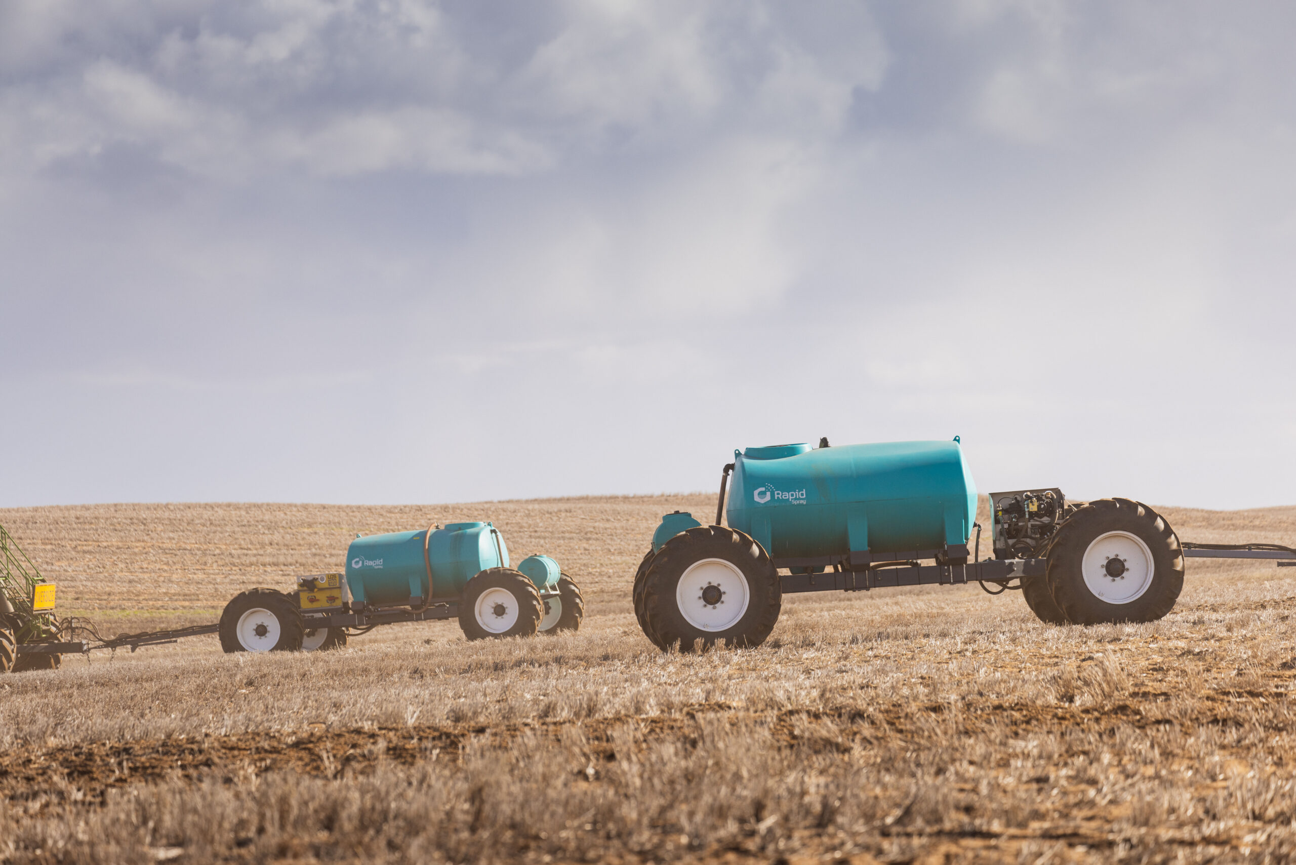 Spray tank that is portable on a trailer