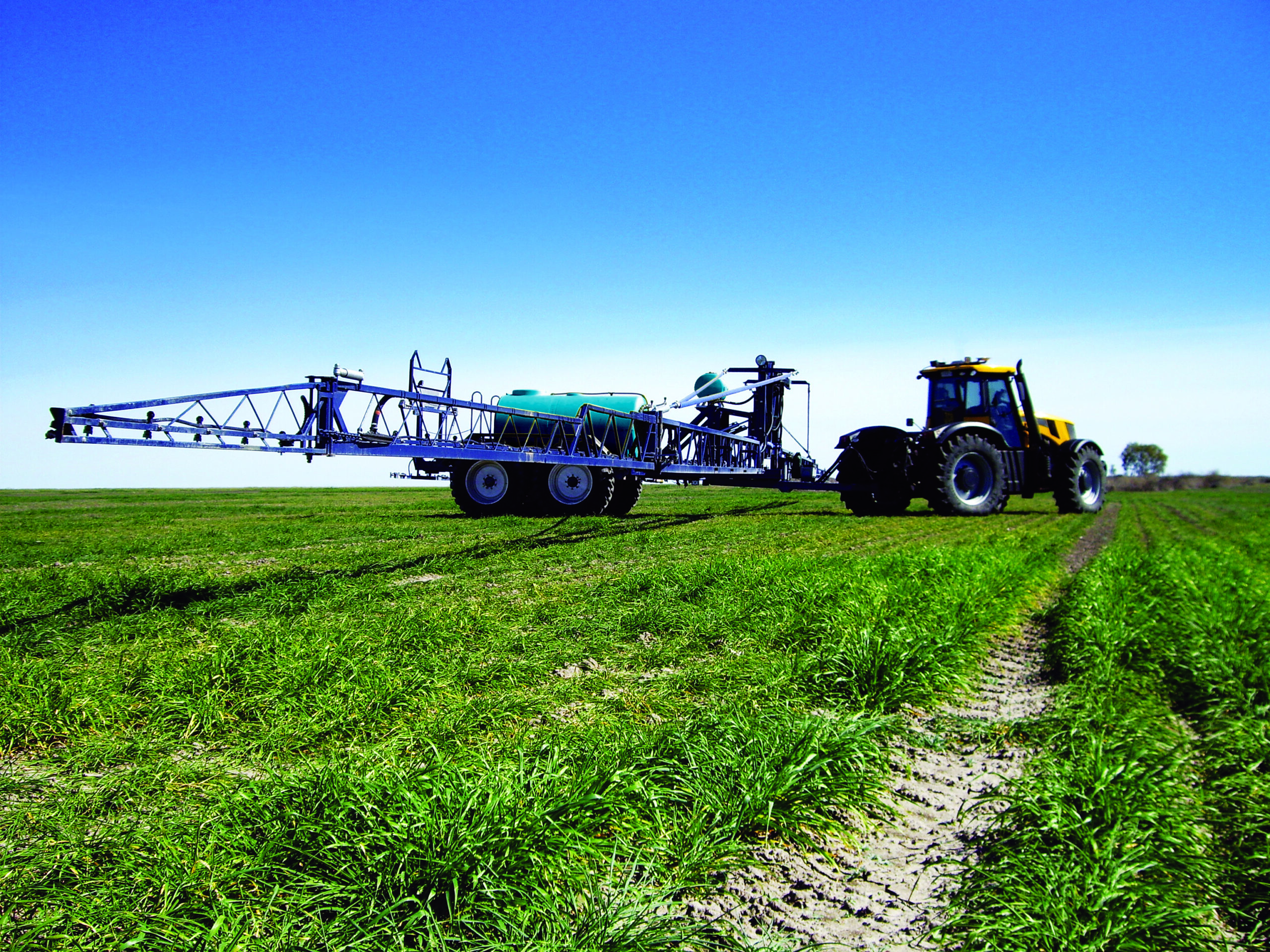 Spray tank with booms on a farm