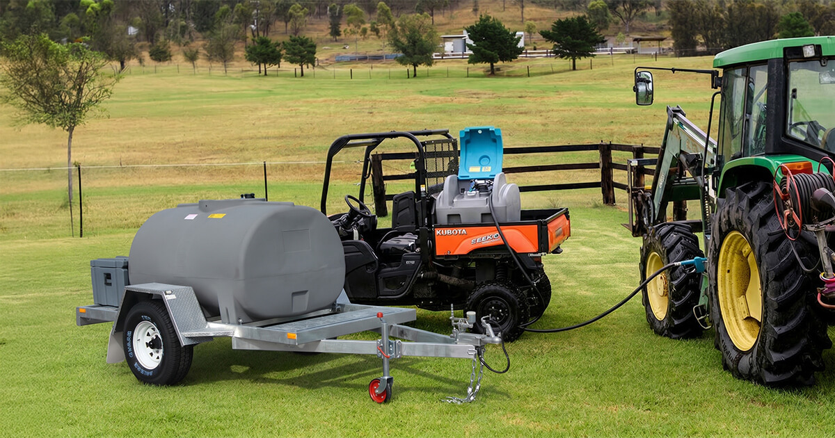 UTV with diesel fuel pod on the back tray alongside a diesel tank trailer used for farm fuel management