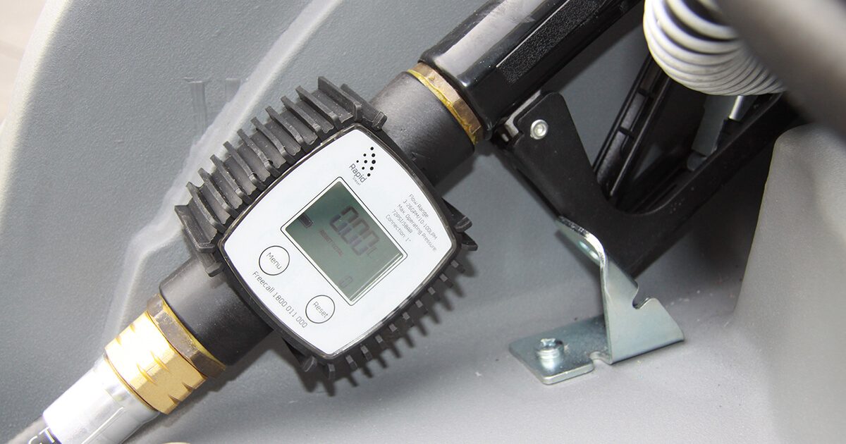 Flow meter installed on a diesel tank showing fuel flow measurement system for agricultural use