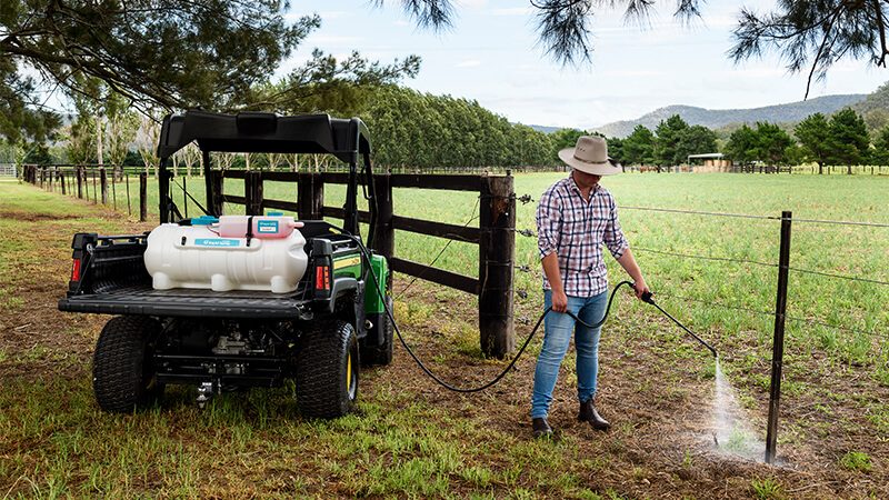 Rapid Spray RapidMix 12V Spot Sprayer mounted on a UTV being used for spot spraying and weed control on a rural property in Australia.
