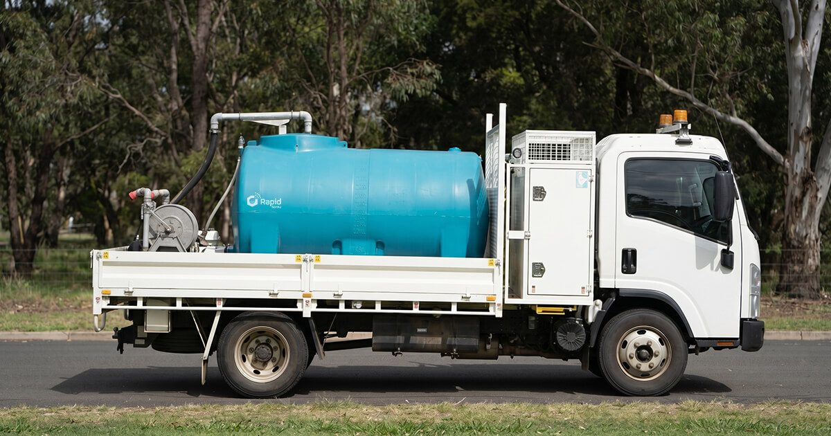 Rapid Spray slip-on water cart mounted on a flatbed truck for agricultural and civil water applications