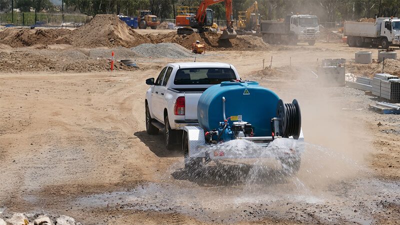 Rapid Spray water cartage trailer spraying water for dust suppression on a construction site